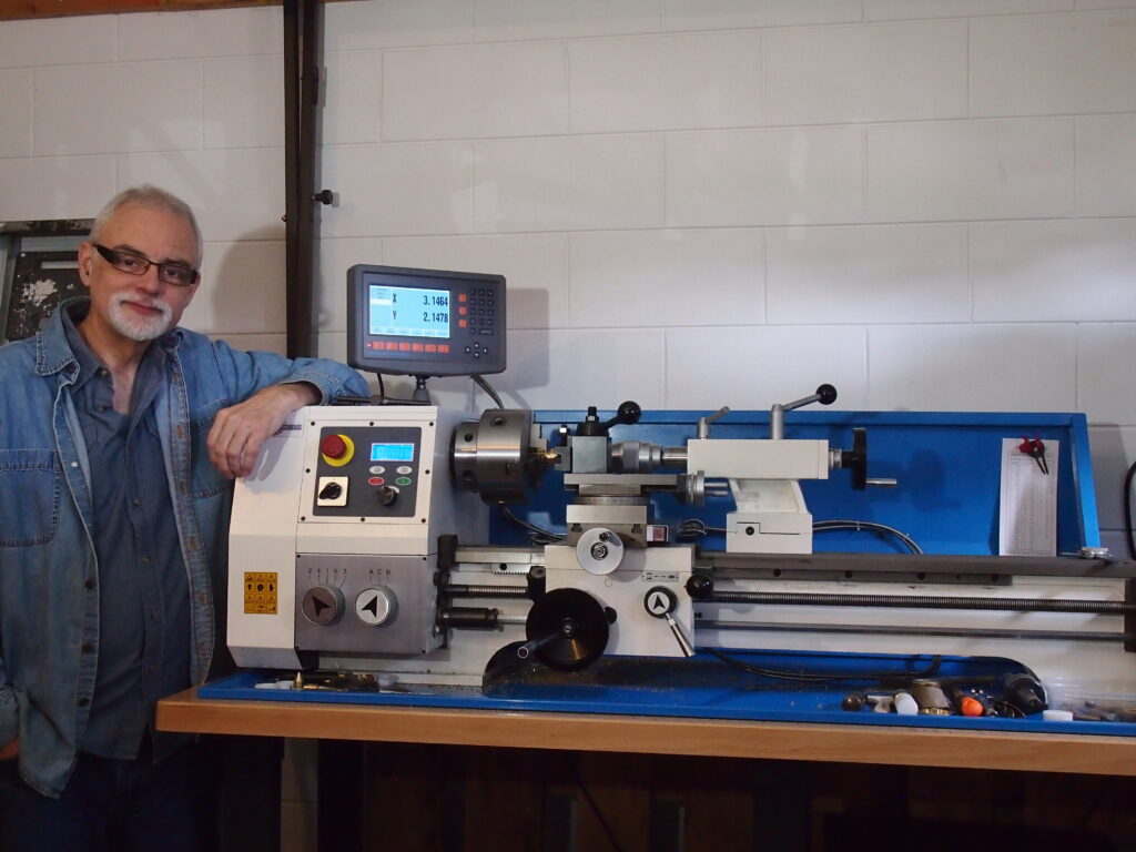Ken Titmus brass instrument mouthpiece maker at lathe. Picture for list of blogs by Ken Titmus about brass playing.